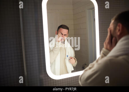 Sleepy Man In Bathroom Stock Photo