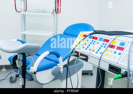 Gynecological surgery room with chair and equipment Stock Photo