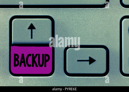 Word writing text Backup. Business concept for copy of file or other item data made in case original is lost damaged. Stock Photo