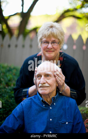 Woman resting on her husband's set Stock Photo