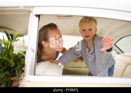 Woman and young boy in a car Stock Photo