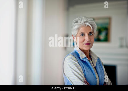 Portrait of a contented mature woman in her home. Stock Photo