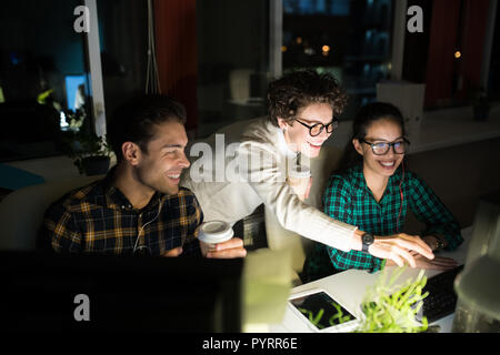 Young Entrepreneurs Working at Night Stock Photo