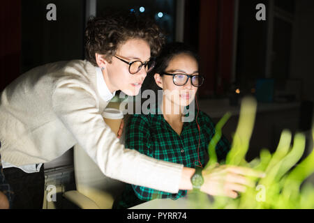 Business Women Working at Night Stock Photo