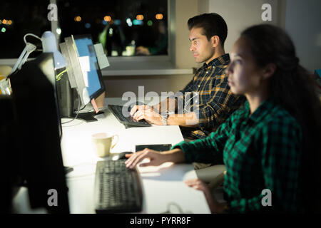 People Using Computers at Work Stock Photo