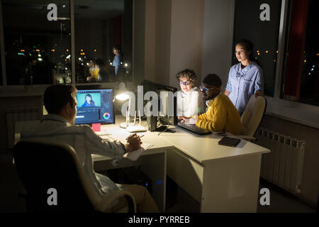 Creative People Working at Night Stock Photo