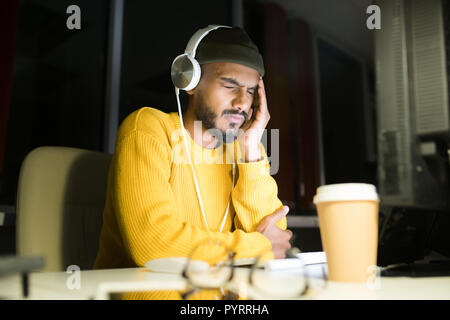 Stressed Young Man at Work Stock Photo