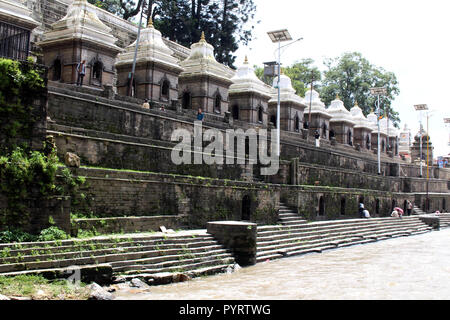 Dozens or hundreds of small temples across Bagmati River of Pashupatinath in Kathmandu. Taken in Nepal, August 2018. Stock Photo