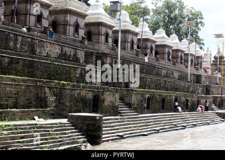 Dozens or hundreds of small temples across Bagmati River of Pashupatinath in Kathmandu. Taken in Nepal, August 2018. Stock Photo