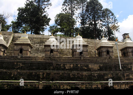 Dozens or hundreds of small temples across Bagmati River of Pashupatinath in Kathmandu. Taken in Nepal, August 2018. Stock Photo