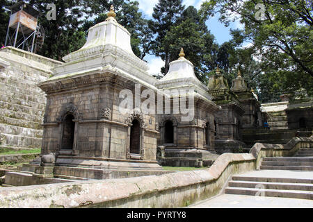 Dozens or hundreds of small temples across Bagmati River of Pashupatinath in Kathmandu. Taken in Nepal, August 2018. Stock Photo