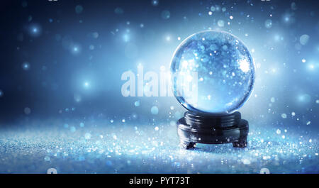 Snow Globe Sparkling In Shiny Background Stock Photo