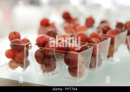 Small cups of gooseberries Stock Photo