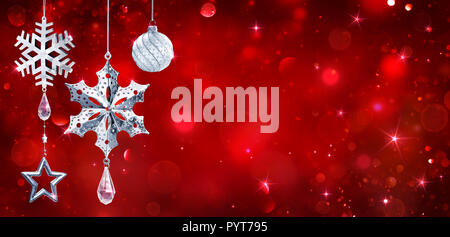 Silver Baubles Hanging In Red Shiny Background Stock Photo