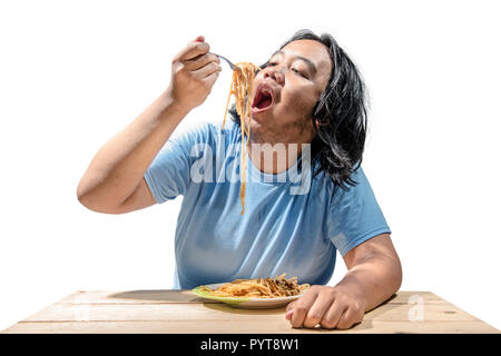 Portrait of asian fat man eating fast food spaghetti isolated over white background. Fat man diet concept Stock Photo