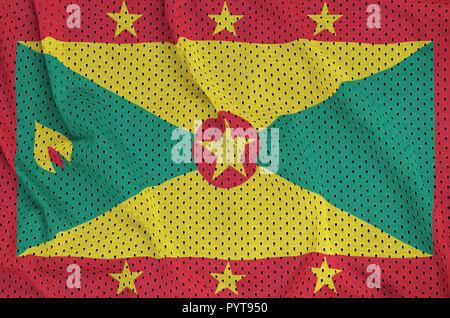 Grenada flag printed on a polyester nylon sportswear mesh fabric with some folds Stock Photo