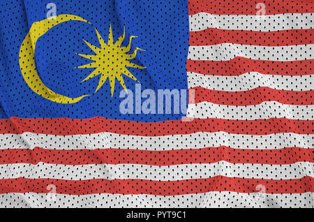 Malaysia flag printed on a polyester nylon sportswear mesh fabric with some folds Stock Photo