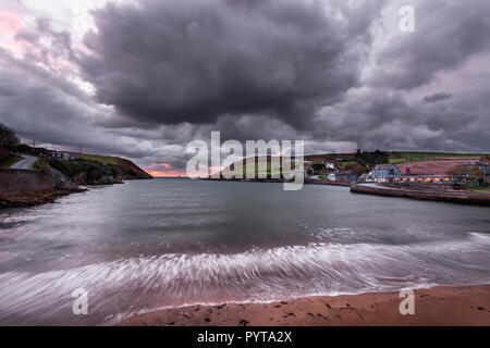 Roberts Cove, Cork, Ireland. 29th October, 2018. Dark clouds roll in before dawn over  the picturesque  village of Roberts Cove in Co. Cork, Ireland. Stock Photo