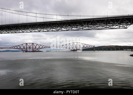 The Old Forth Road Bridge and the Forth Rail Bridge over the Firth of Forth in Queensferry, Edinburgh Scotland United Kingdom UK Stock Photo
