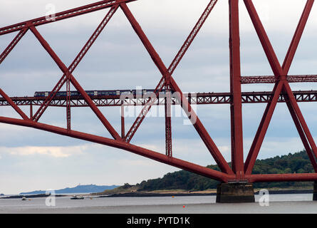A Passenger Train Crossing the Forth Railway Bridge over The Firth of Forth at South Queensferry near Edinburgh Scotland United Kingdom UK