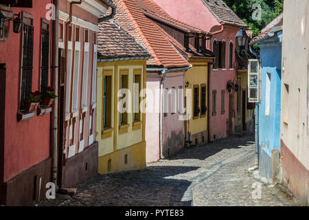 ROMANIA, SIGHISOARA.  Narrow cobblestone streets are typical for the old city center of Sighisoara, a UNESCO world heritage site Stock Photo