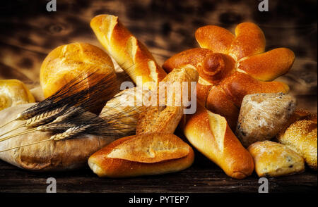 Variety types of bread on wood table. Stock Photo