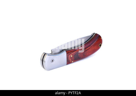 Foldable pocket knife with wooden handle in folded state on white isolated background. Stock Photo