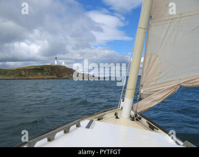 Sailing yacht Speedwell, a Romilly 23, south of Little Ross Island lighthouse in the Solway Firth, Dumfries and Galloway Stock Photo