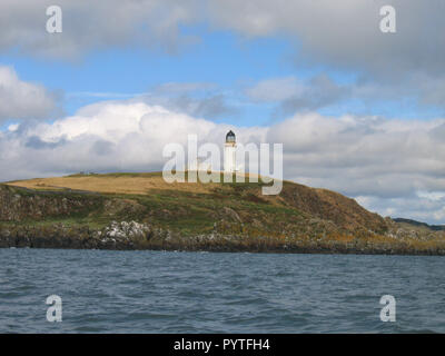 Little Ross lighthouse on Little Ross Island seen from a boat looking north east. Stock Photo