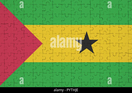 Sao Tome and Principe flag  is depicted on a folded puzzle Stock Photo