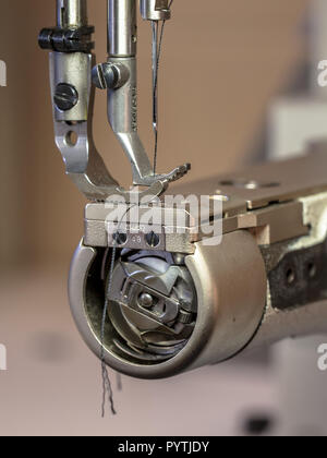 Industrial sewing machine in a leather workshop Stock Photo