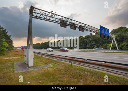 Traffic Sign Gantry over the A12 motorway in the Hoge Veluwe of the Netherlands Stock Photo