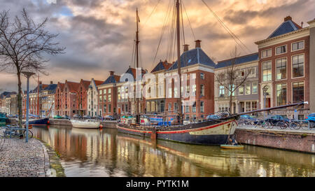 Old buildings on Hoge der Aa Quay in Groningen city centre at sunset, Netherlands Stock Photo
