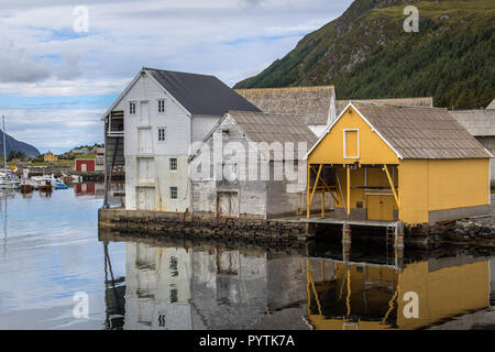 Old wooden warehouses in the harbour of Runde Island Norway Stock Photo