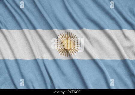 Argentina flag  is depicted on a sports cloth fabric with many folds. Sport team waving banner Stock Photo