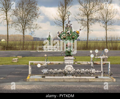 Wellhead in working natural gas field processing site in northern Europe Stock Photo
