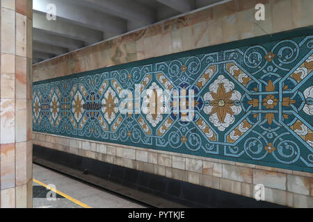 Murals from the Soviet era decorating Pakhtakor Station dedicated to the cotton industry at the Tashkent underground Metro in Uzbekistan. The Tashkent Metro built in the former USSR is one of only two subway systems currently operating in Central Asia and its stations are among the most ornate in the world. Stock Photo
