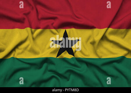 Ghana flag  is depicted on a sports cloth fabric with many folds. Sport team waving banner Stock Photo