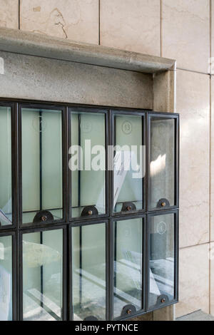 Old and refined letterboxes at the entrance of a building Stock Photo