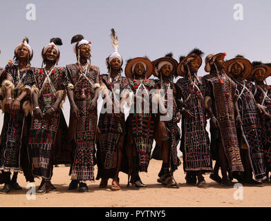 Men dancing Yaake dance and sing at Guerewol festival - 23 september 2017 InGall village, Agadez, Niger Stock Photo