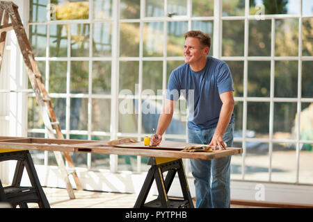 Mid adult man working on a construction site. Stock Photo