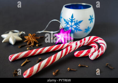 Candy cane Christmas decoration and various Christmas spices Stock Photo