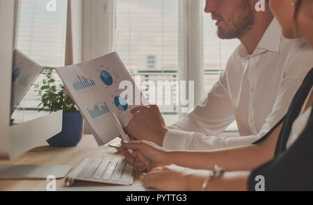Business meeting, group of people analazyng financial charts. Strategy growth and development. Stock Photo