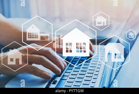buy house, real estate concept, different offers of property online, hands typing on computer as background Stock Photo