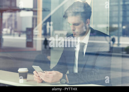 Technology, business man using mobile app on smartphone, double exposure. Stock Photo