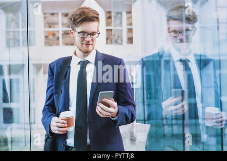 banking online, businessman using smartphone mobile app outside Stock Photo