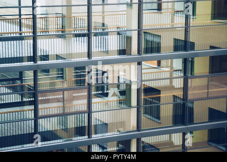 October 19, 2018. Germany Helios Klinikum Krefeld. Doctor doctor walk moving along corridor between stations of clinic on floor view through the windo Stock Photo