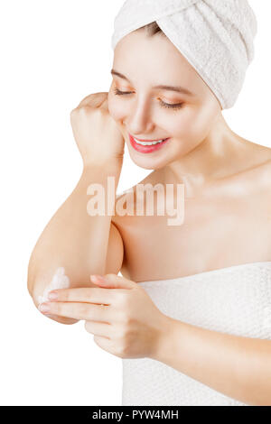 Close-up of a woman takes care of his elbows using cosmetic cream isolated on a white background Stock Photo