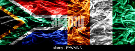 South Africa vs Ivory Coast smoke flags placed side by side. Concept and idea flags mix Stock Photo