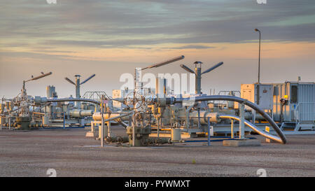 Natural gas production plant in the Waddensea area with pipe line valves Stock Photo